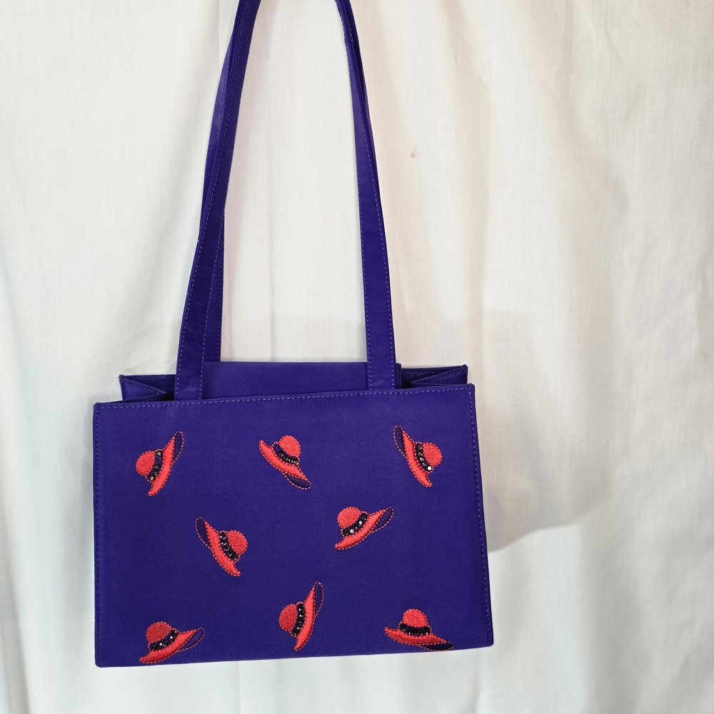 Elegant Purple Shoulder Bag with Red Hat Design